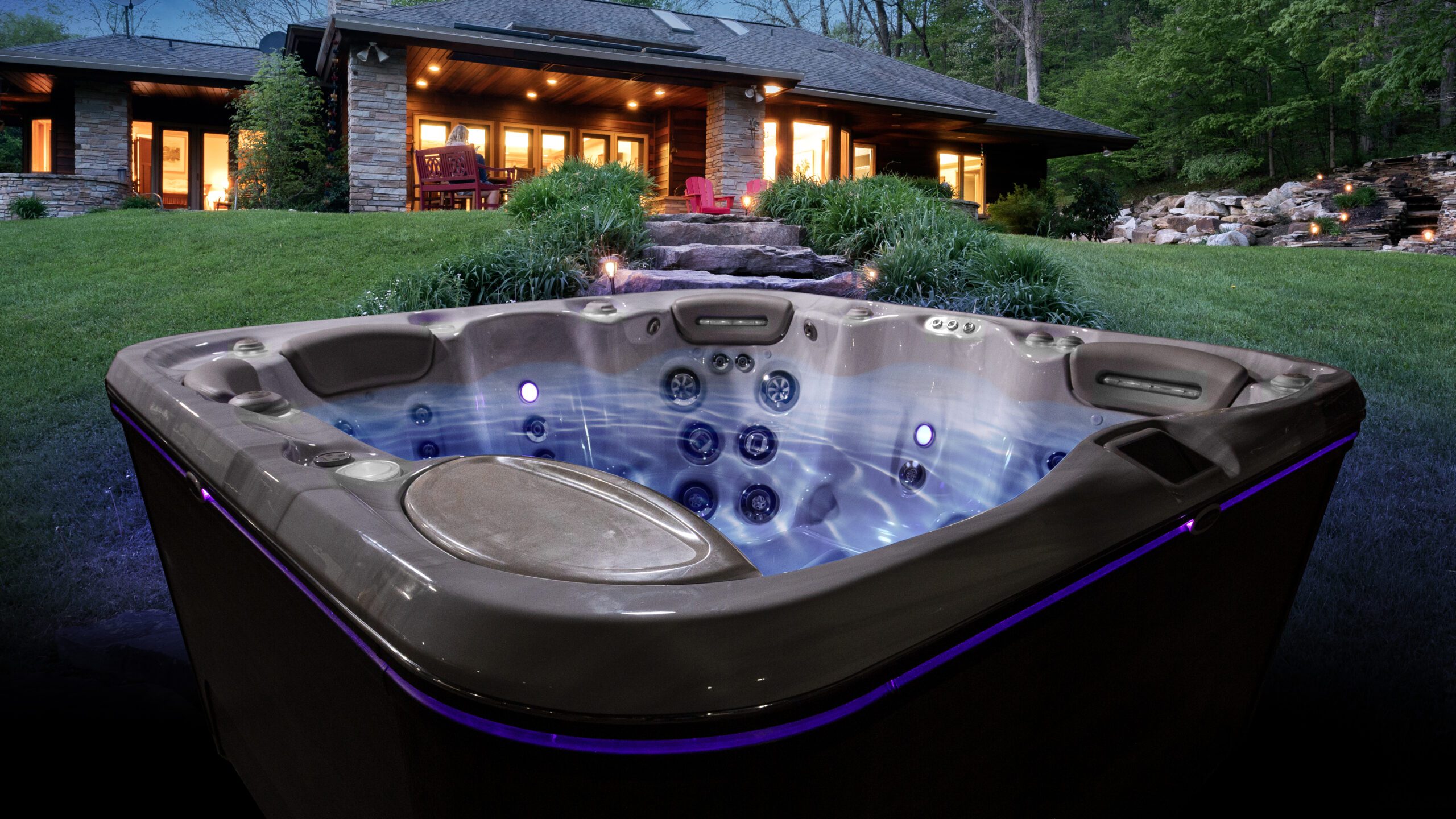 Hydropool Hot Tub with water and lights at night time - Lunar Lagoons Ohio